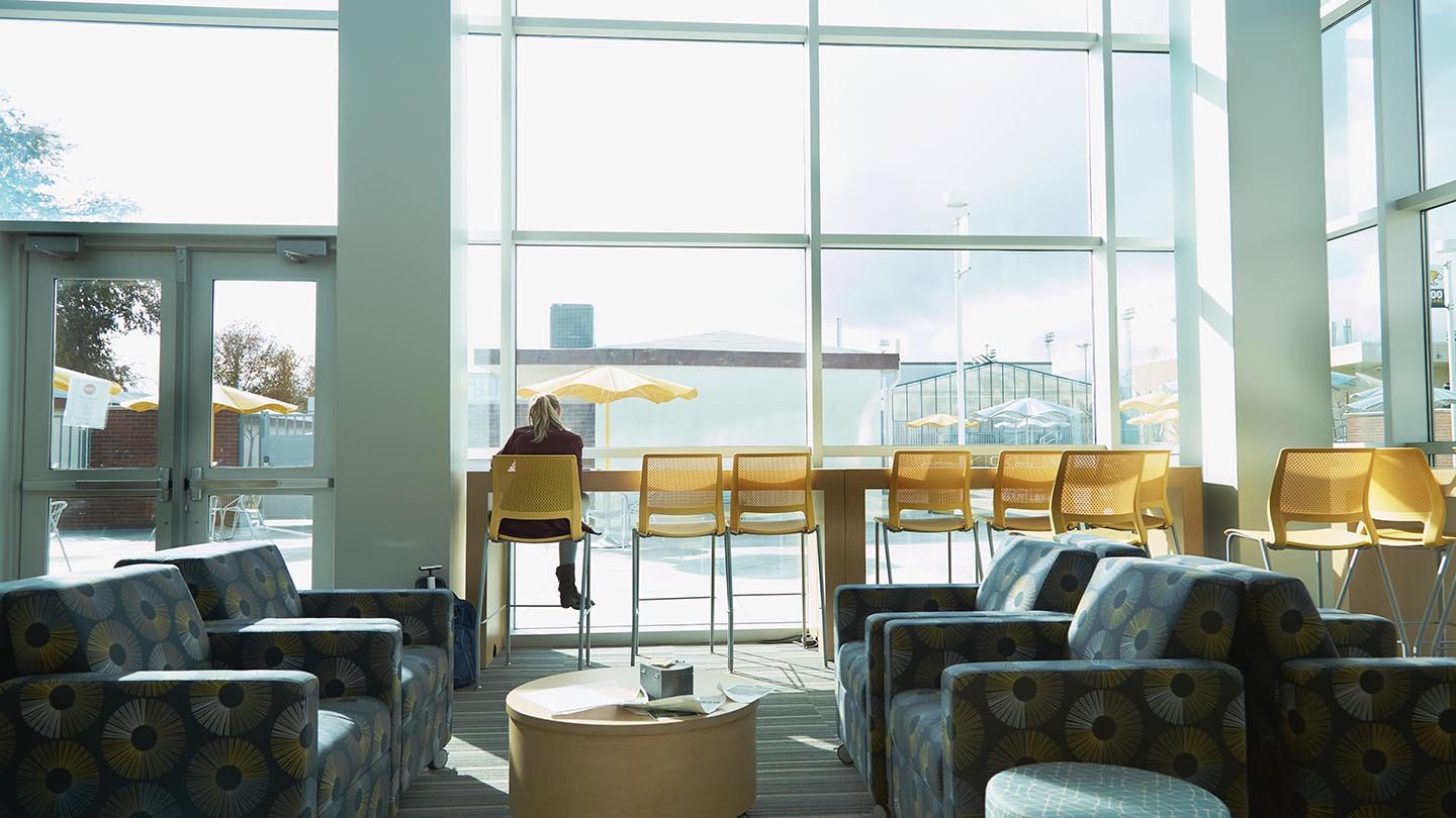 A student enjoys solitude in the Student Center lounge.